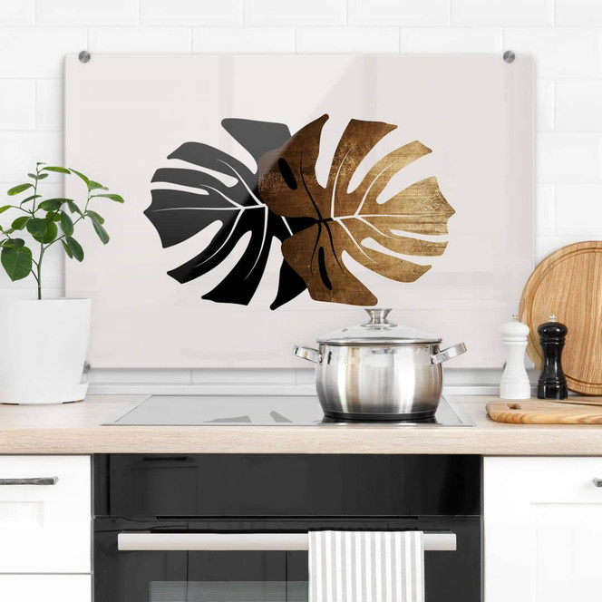 Spritzschutz Kubistika - Schwarz-goldene Monstera Blätter