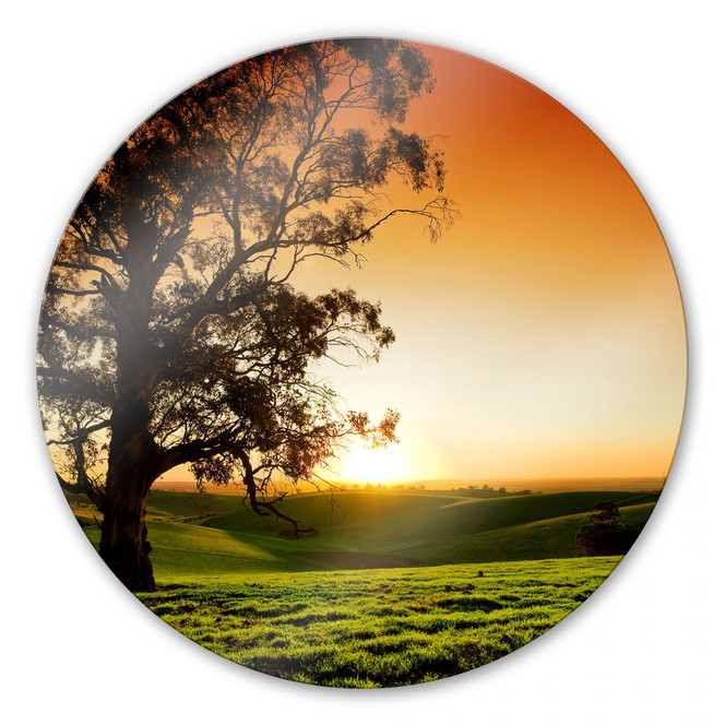 Glasbild Sonnenuntergang über den Hügeln - rund