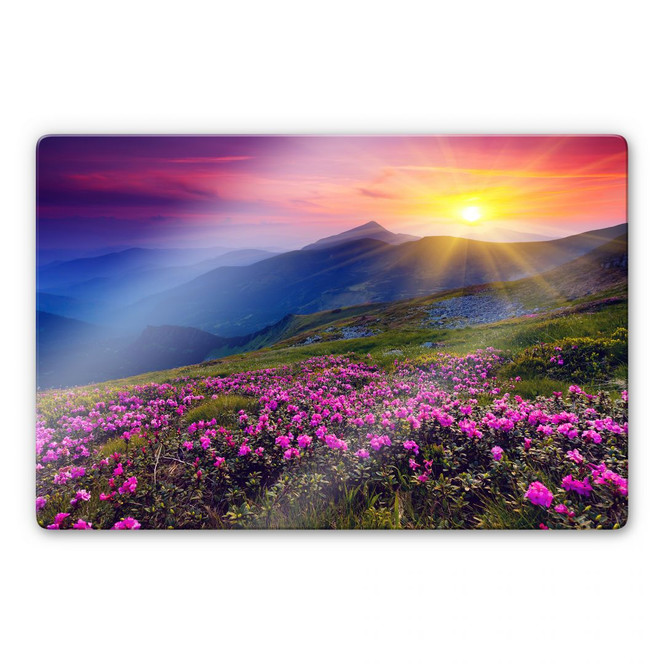 Glasbild Sonnenuntergang in den Bergen