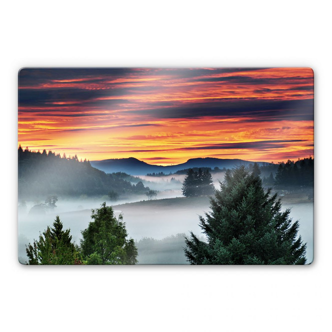 Glasbild Nebel in den Bergen