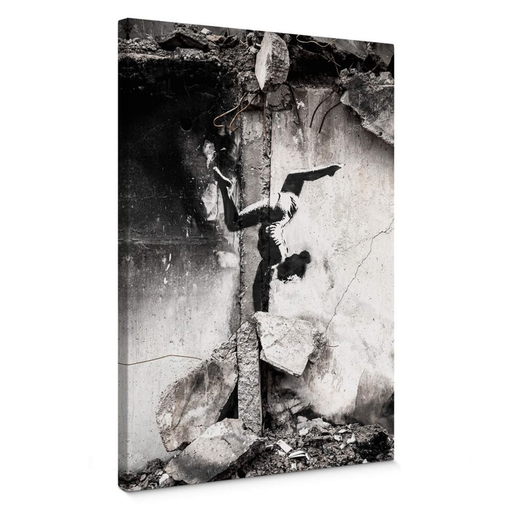 Leinwandbild Banksy in der Ukraine - Handstand in den Trümmern - WA358024