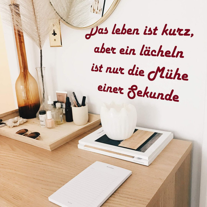 Wandtattoo Das Leben ist kurz, aber ein Lächeln... - WA208019